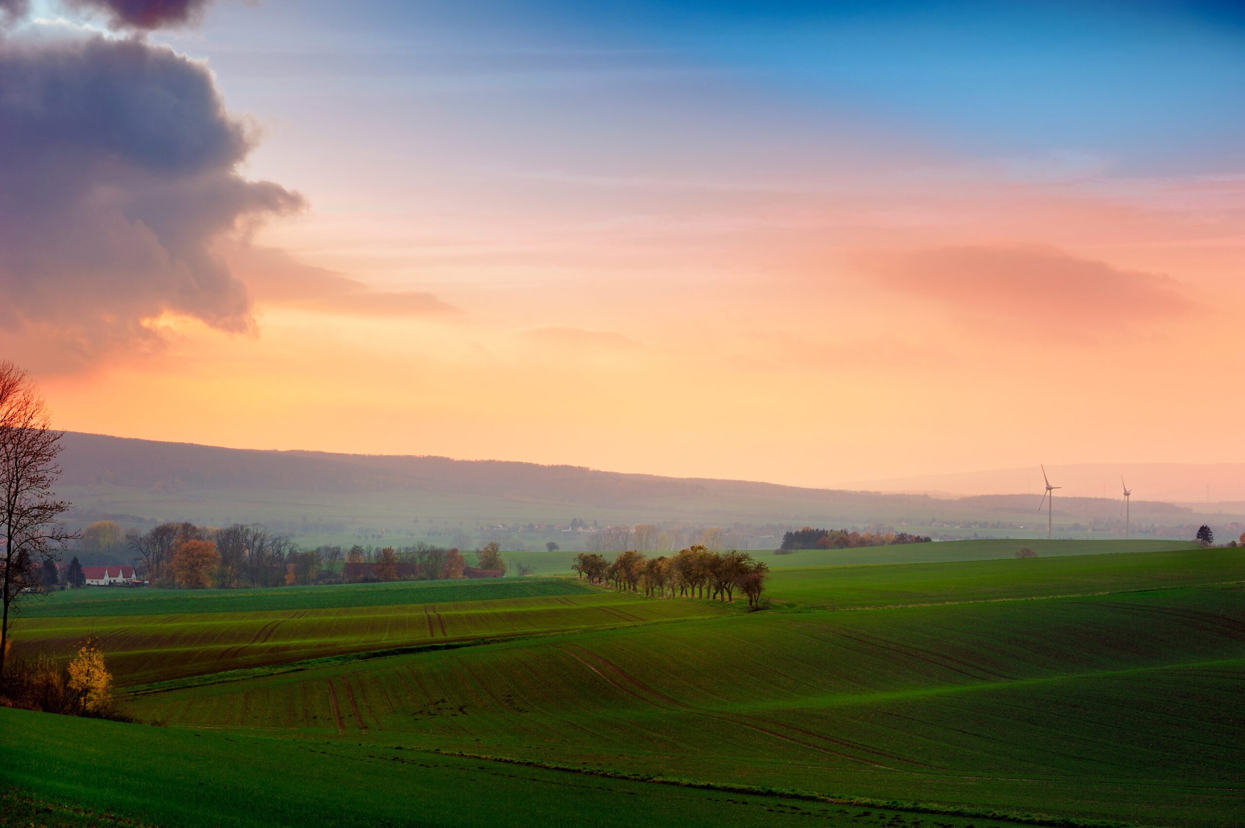 Misty sunset,golden sunbeam shine through the Deister. Schloss Fulda